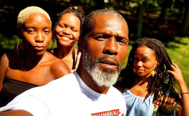 Curtiss Cook with daughters, Isis, Kimani, and Jade.